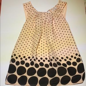 Pink and black polka dotted sleeveless blouse